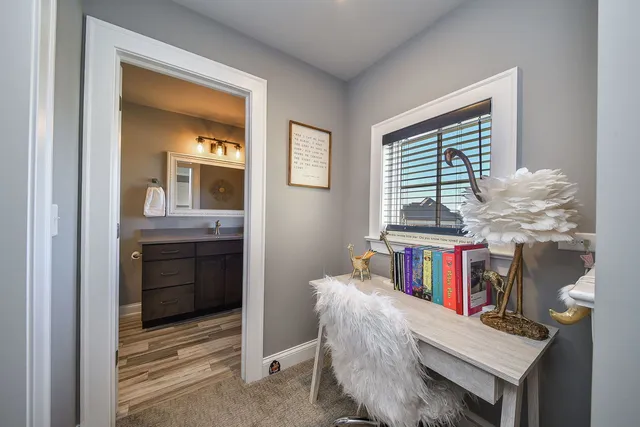 a kitchen with stainless steel appliances and white cabinets
