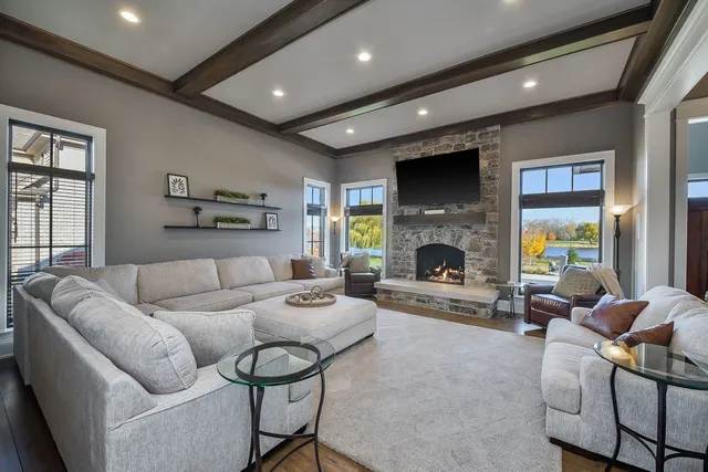 a living room with furniture fireplace and a flat screen tv