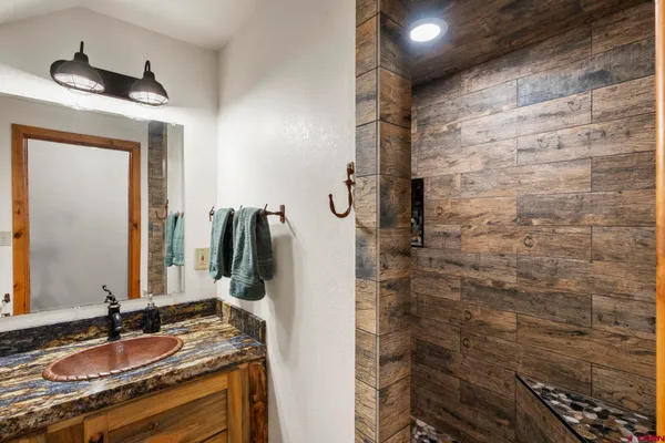 a bedroom with a bed and a walk in closet