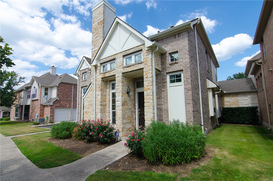 14812 Avery Ranch Boulevard, Unit 30 Austin, TX 78717 - Photo 1 of 1 a view of a brick house with a yard