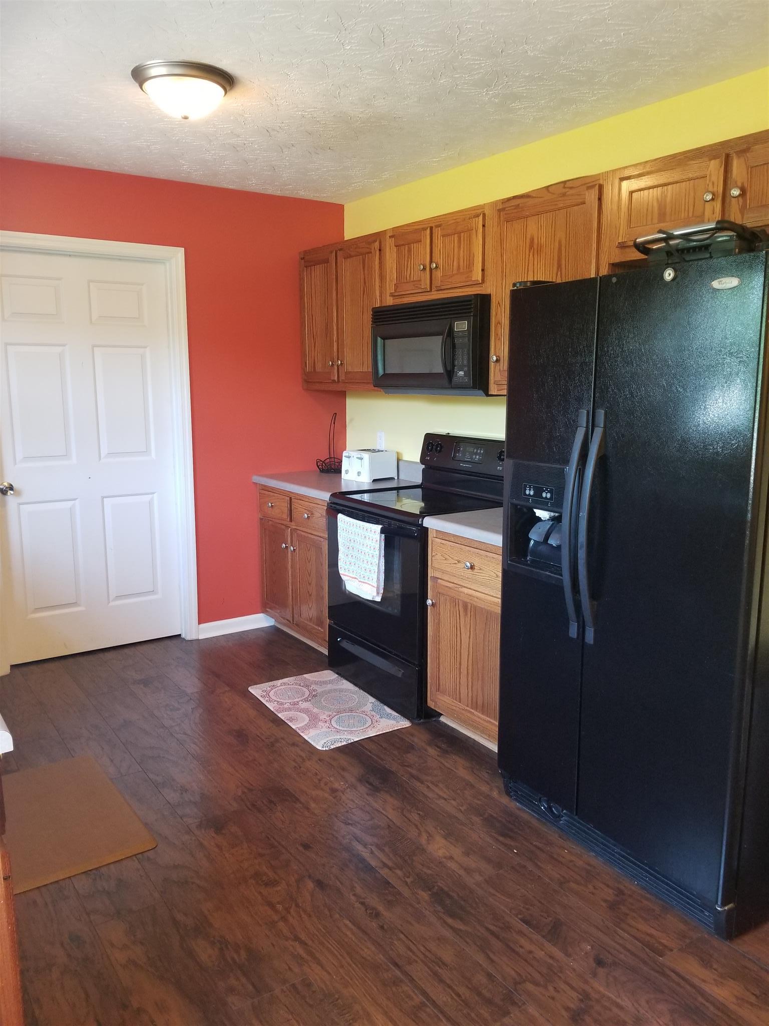 292 Trent Road Lafayette, TN 37083 - Photo 5 of 16 Flooring flows through into the kitchen.