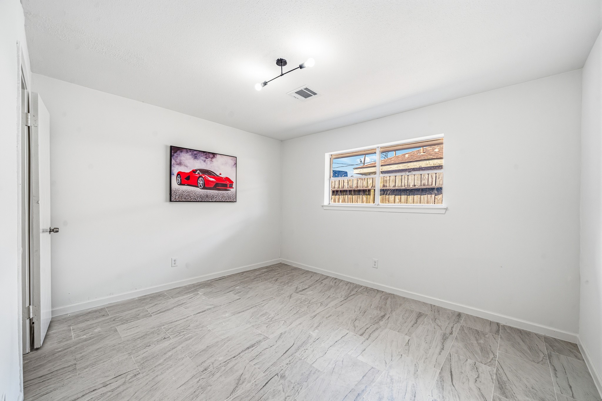 111 Princess Drive Houston, TX 77034 - Photo 11 of 30 a view of room with wooden floor and window