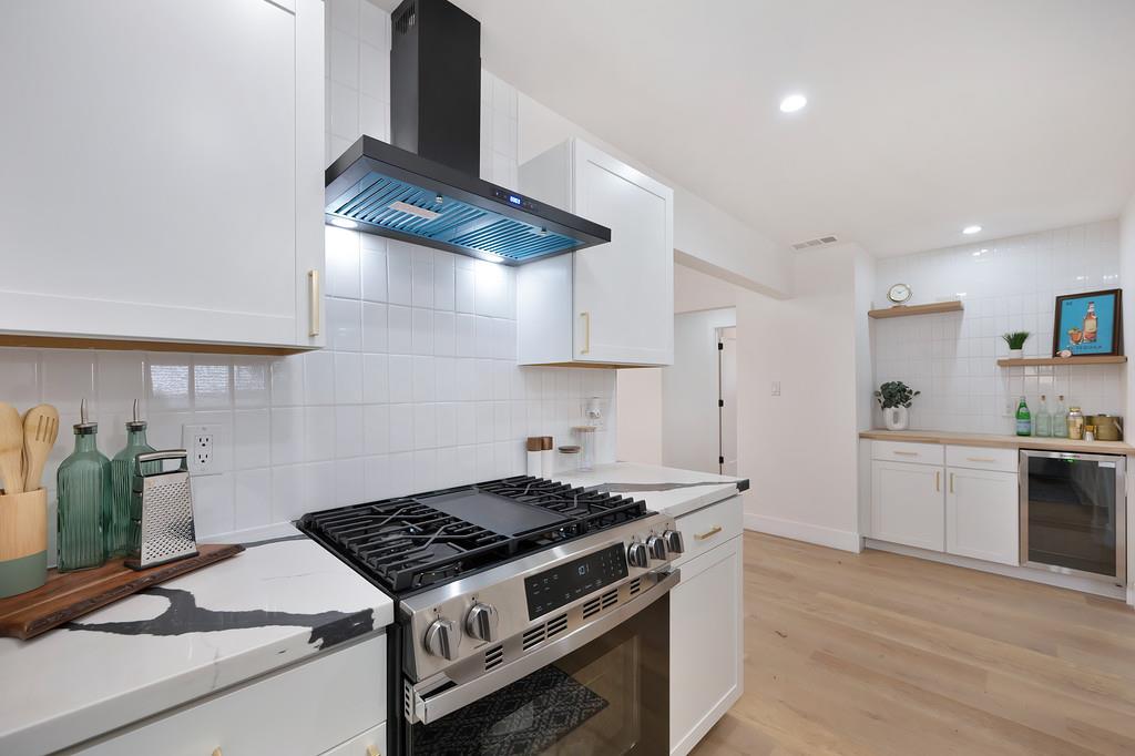 2316 West Swain Road Stockton, CA 95207 - Photo 13 of 46 a kitchen with stainless steel appliances granite countertop a stove and a sink