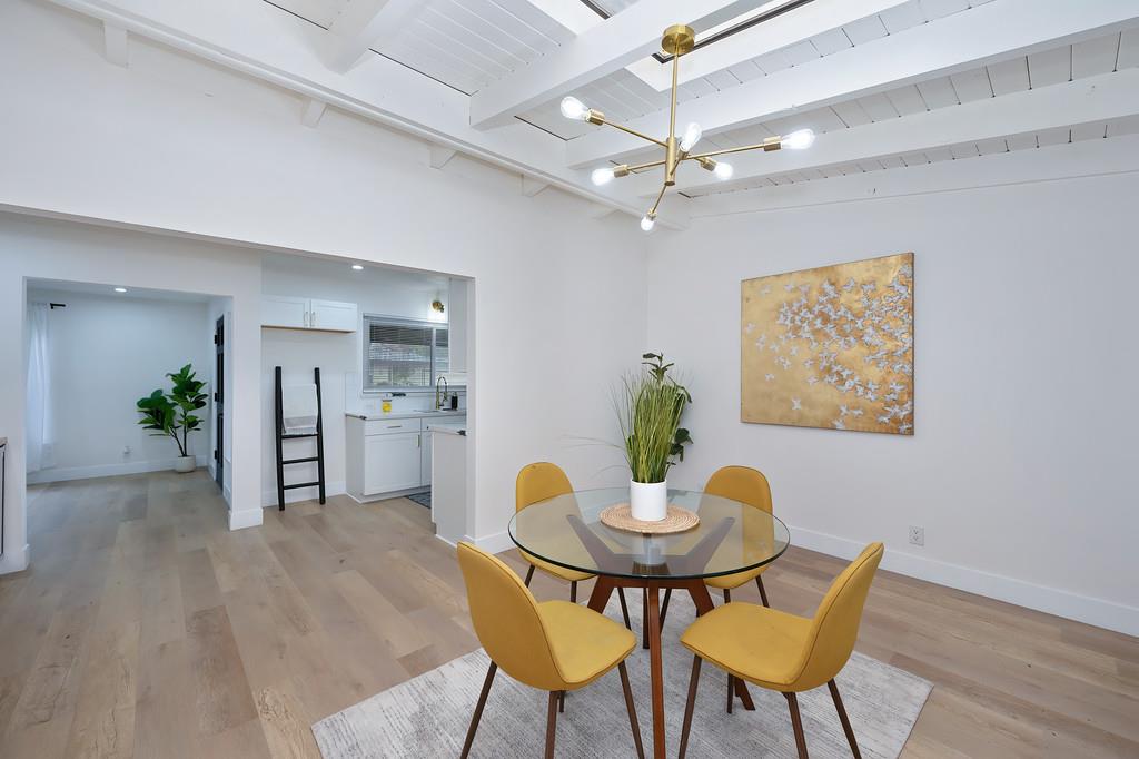 2316 West Swain Road Stockton, CA 95207 - Photo 18 of 46 a view of a dining room with furniture and wooden floor