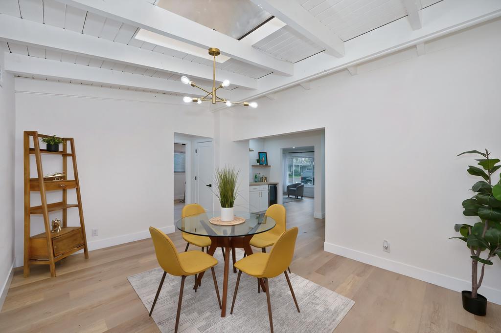 2316 West Swain Road Stockton, CA 95207 - Photo 19 of 46 a view of a dining room with furniture and wooden floor