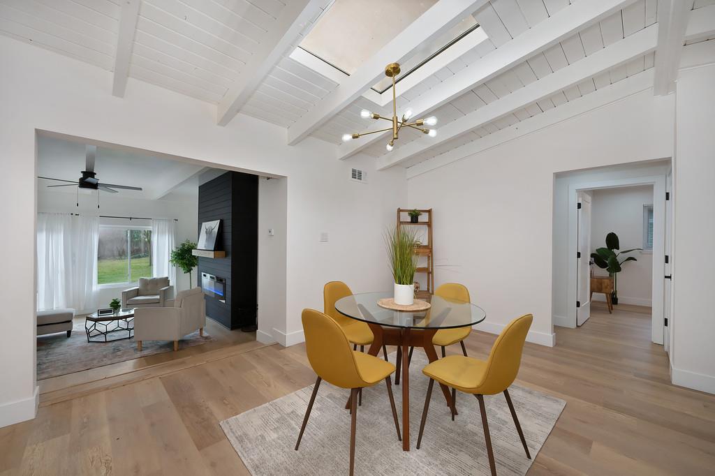 2316 West Swain Road Stockton, CA 95207 - Photo 20 of 46 a view of a dining room with furniture and a chandelier