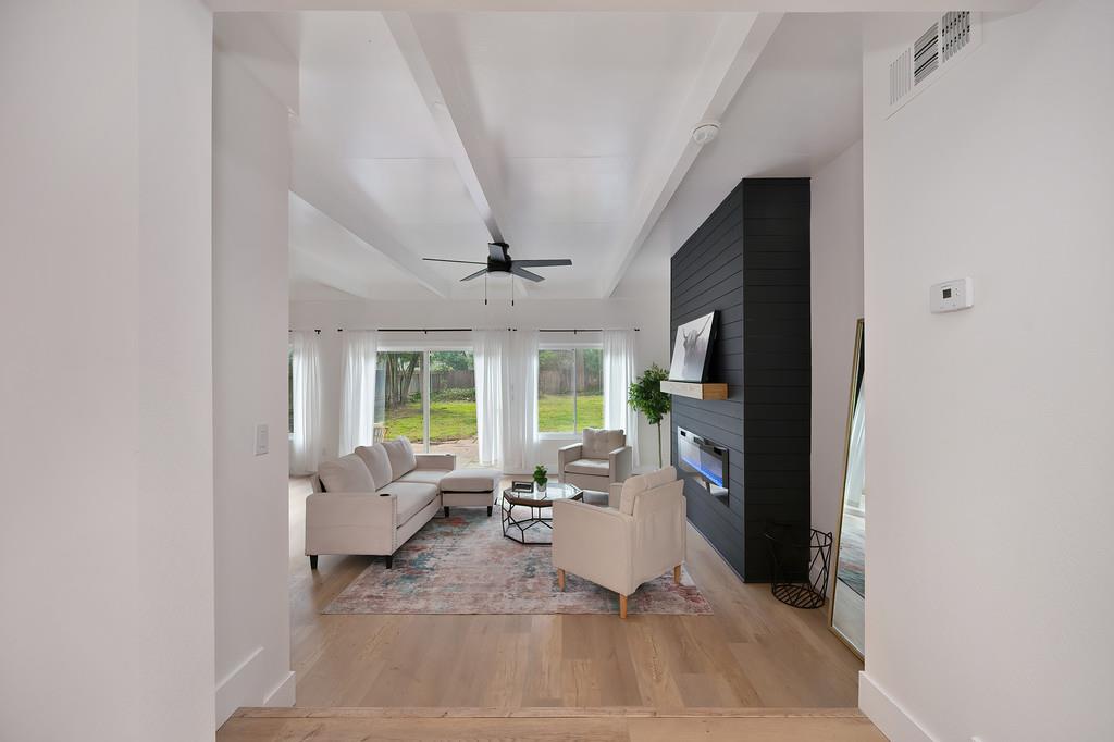 2316 West Swain Road Stockton, CA 95207 - Photo 21 of 46 a living room with furniture large window and flat screen tv