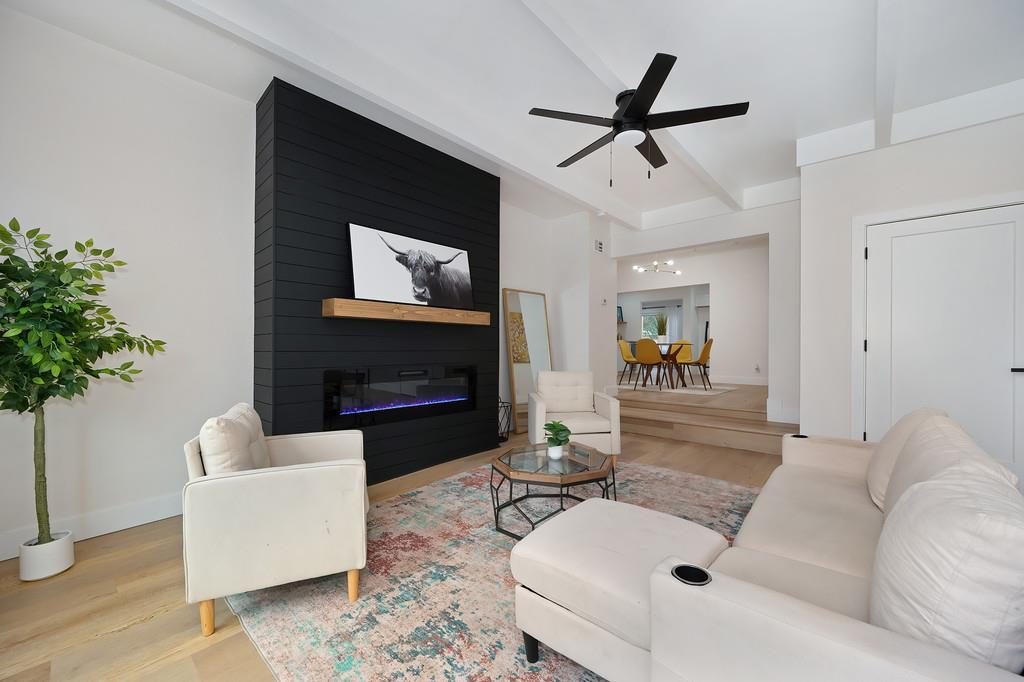 2316 West Swain Road Stockton, CA 95207 - Photo 23 of 46 a living room with furniture and a fireplace