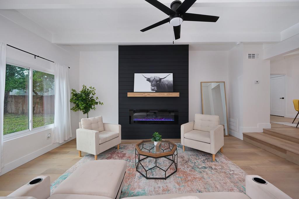 2316 West Swain Road Stockton, CA 95207 - Photo 24 of 46 a living room with furniture and a fireplace