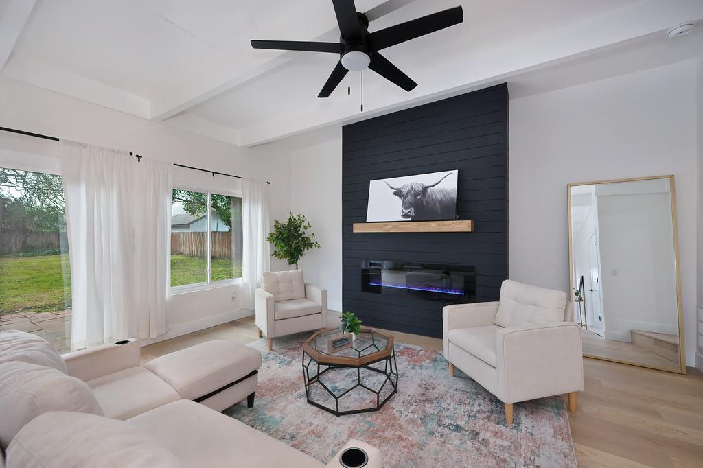 2316 West Swain Road Stockton, CA 95207 - Photo 25 of 46 a living room with furniture and a large window