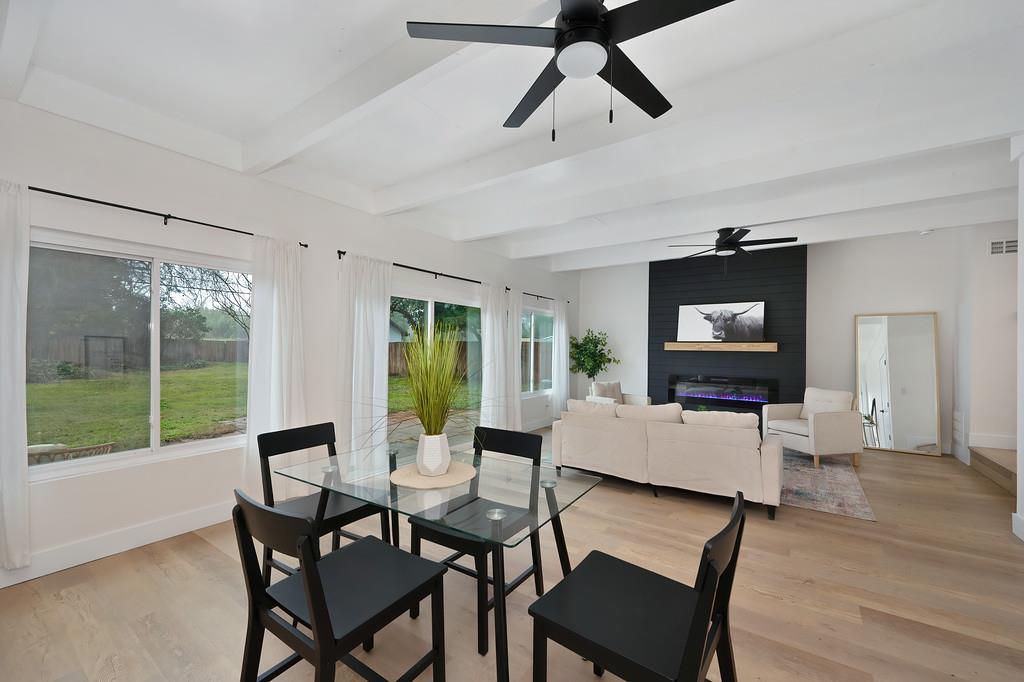 2316 West Swain Road Stockton, CA 95207 - Photo 30 of 46 a living room with furniture a flat screen tv and a large window