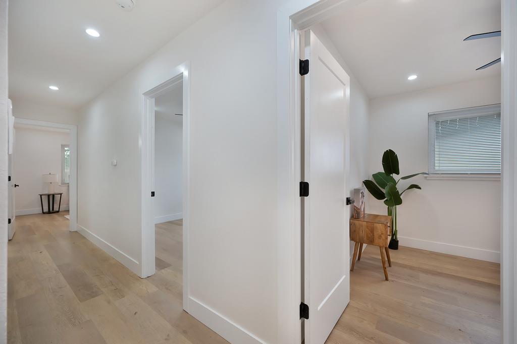 2316 West Swain Road Stockton, CA 95207 - Photo 31 of 46 a view of a hallway view with wooden floor
