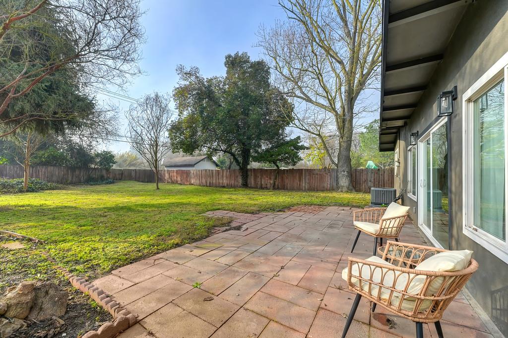 2316 West Swain Road Stockton, CA 95207 - Photo 42 of 46 a chair and table sitting in backyard of a house
