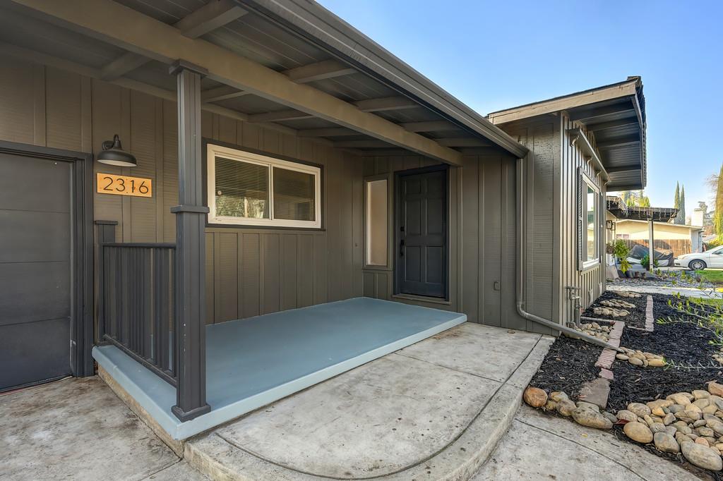 2316 West Swain Road Stockton, CA 95207 - Photo 5 of 46 a view of a porch with furniture and next to a window