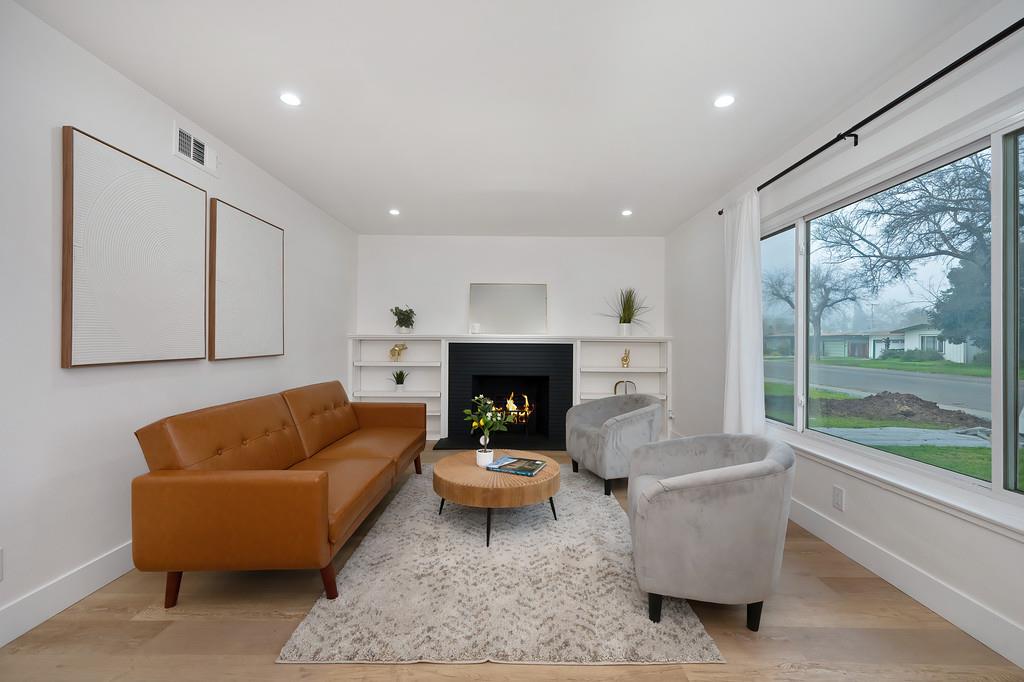 2316 West Swain Road Stockton, CA 95207 - Photo 6 of 46 a living room with furniture and a fireplace