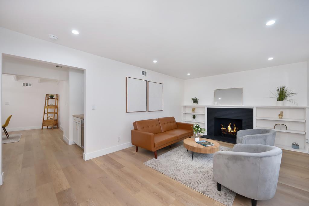 2316 West Swain Road Stockton, CA 95207 - Photo 9 of 46 a living room with furniture and a fireplace