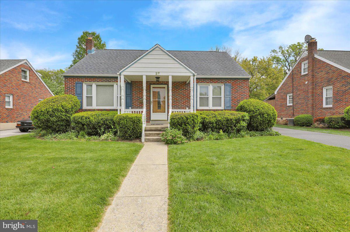 27 Woodland Road Reading, PA 19610 - Photo 1 of 34 a front view of a house with a yard