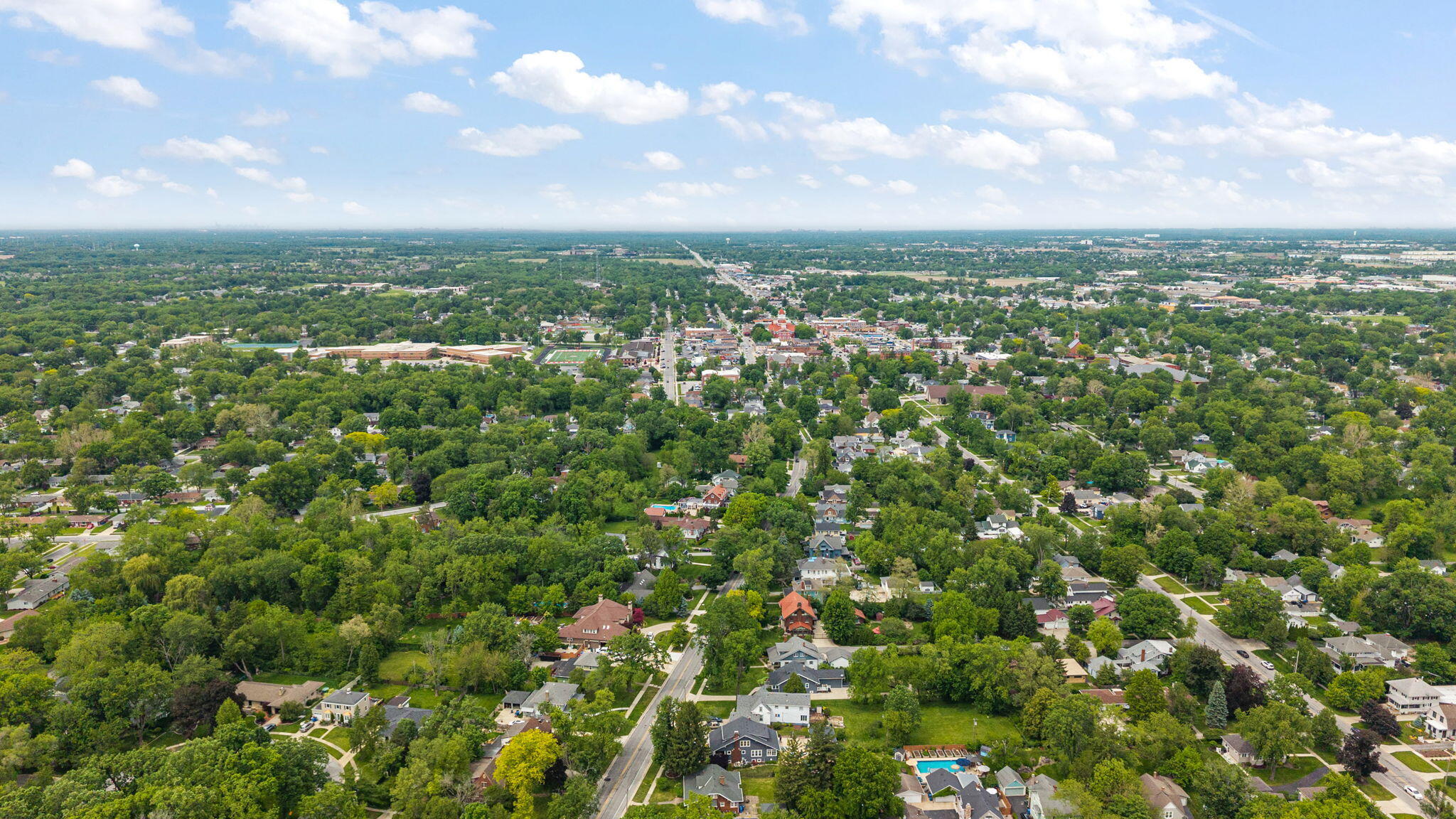 504 South Court Street Crown Point, IN 46307 - Photo 53 of 61 an aerial view of residential houses with outdoor space and trees