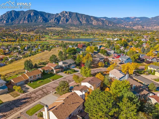 an aerial view of residential houses with outdoor space