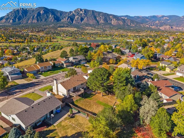 an aerial view of residential house with swimming pool