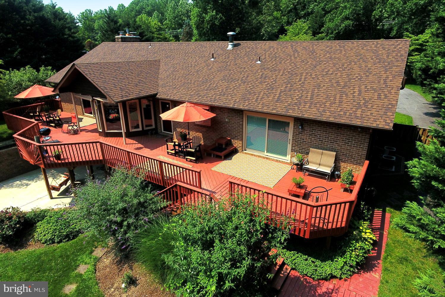 5497 Solomons Island Road Lothian, MD 20711 - Photo 3 of 30 Dining and Grilling Deck Surveying Lush Acreage