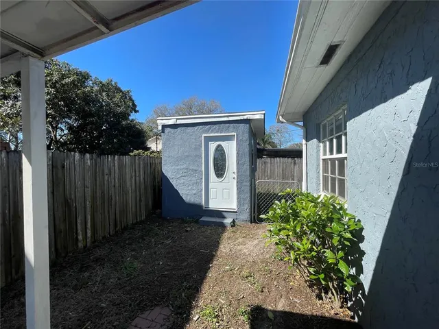 a backyard of a house with lots of green space