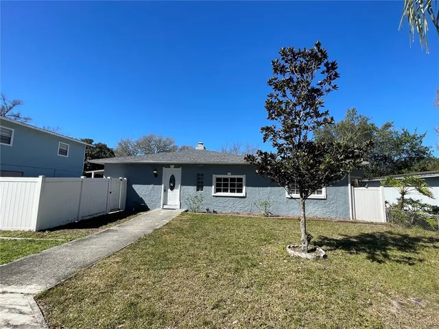 a house view with a backyard space