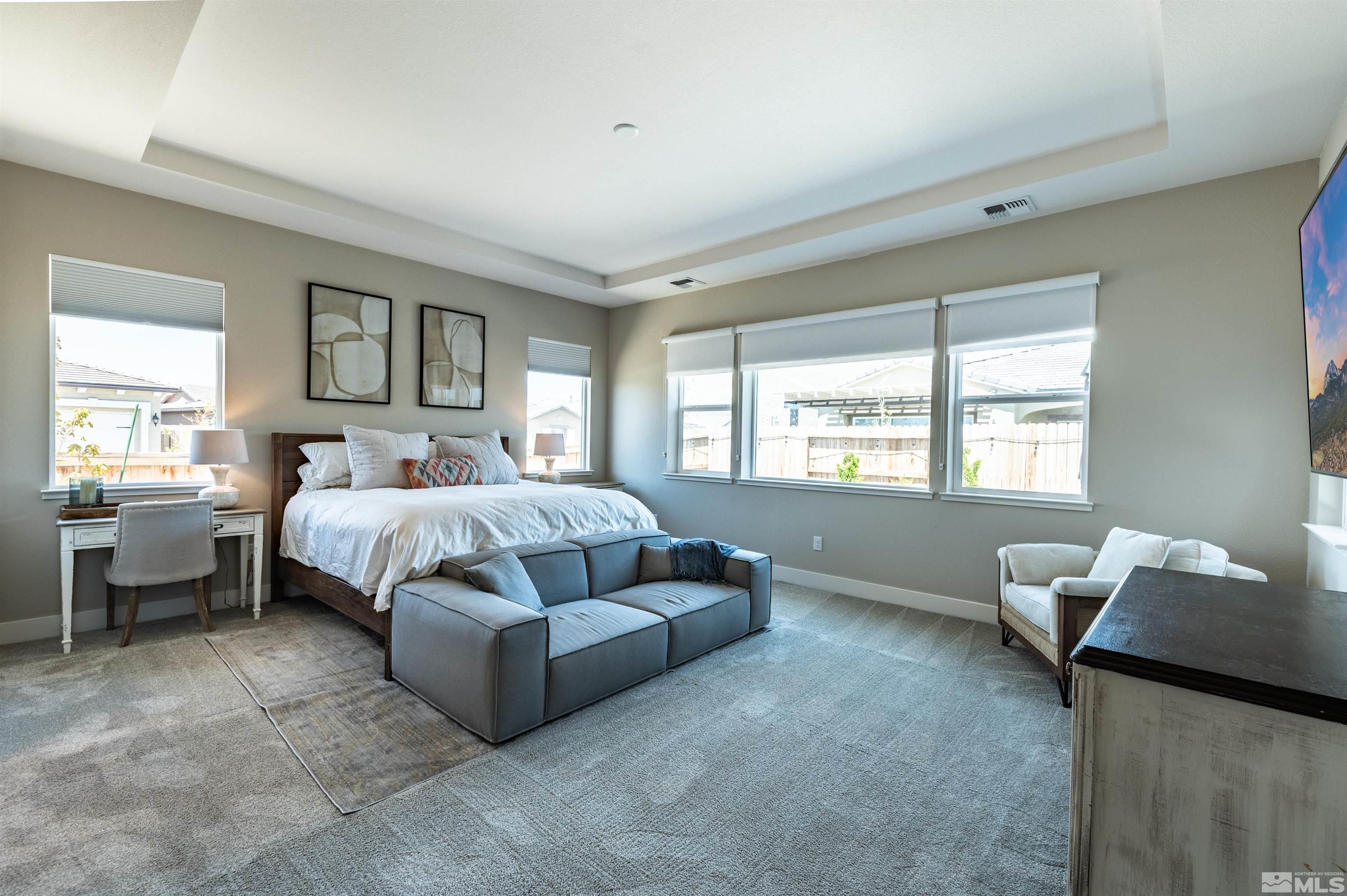 9604 Copperhorn Way Reno, NV 89521 - Photo 17 of 39 a bedroom with a bed and a couch