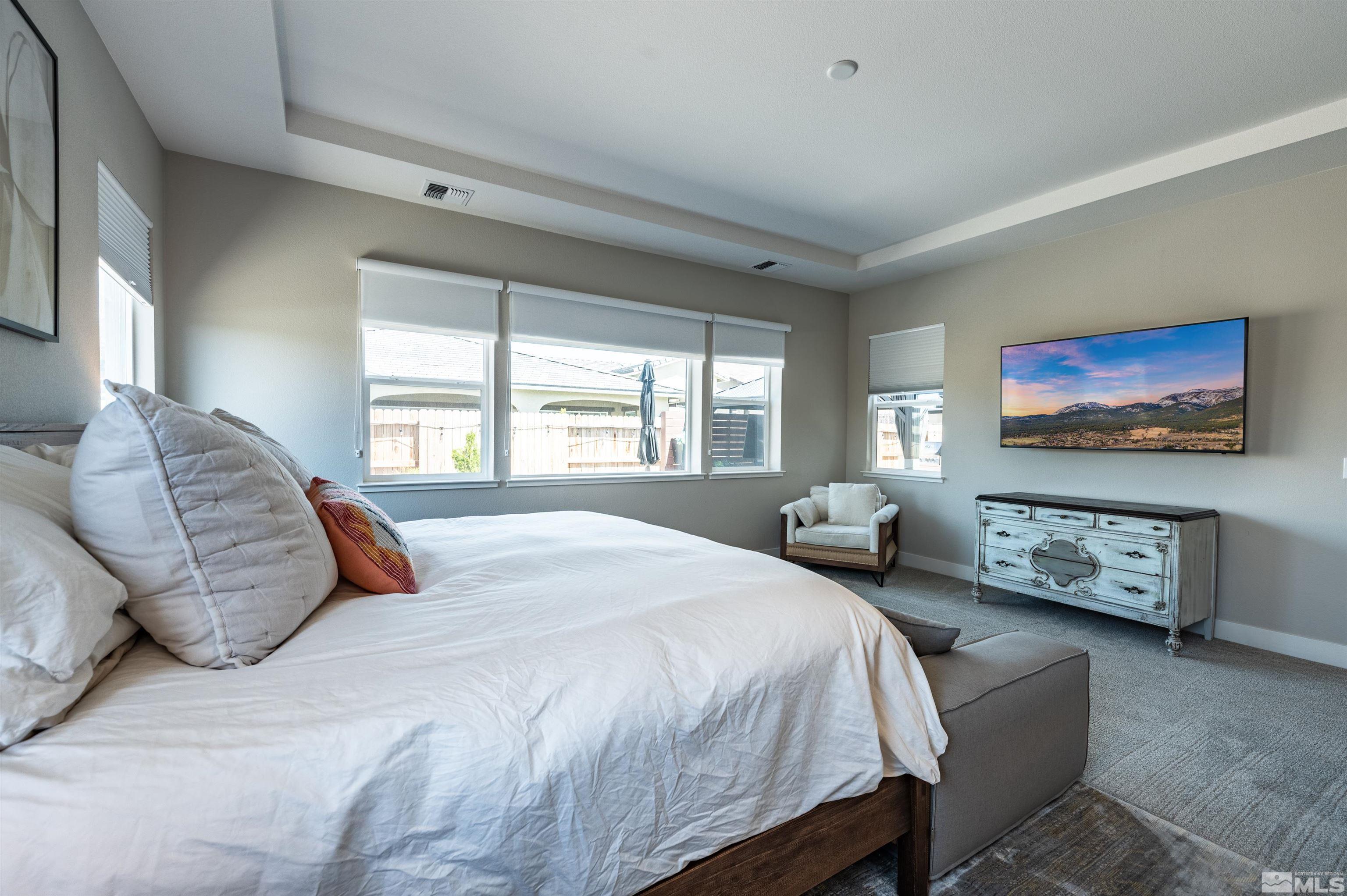 9604 Copperhorn Way Reno, NV 89521 - Photo 18 of 39 a bedroom with a bed and a couch