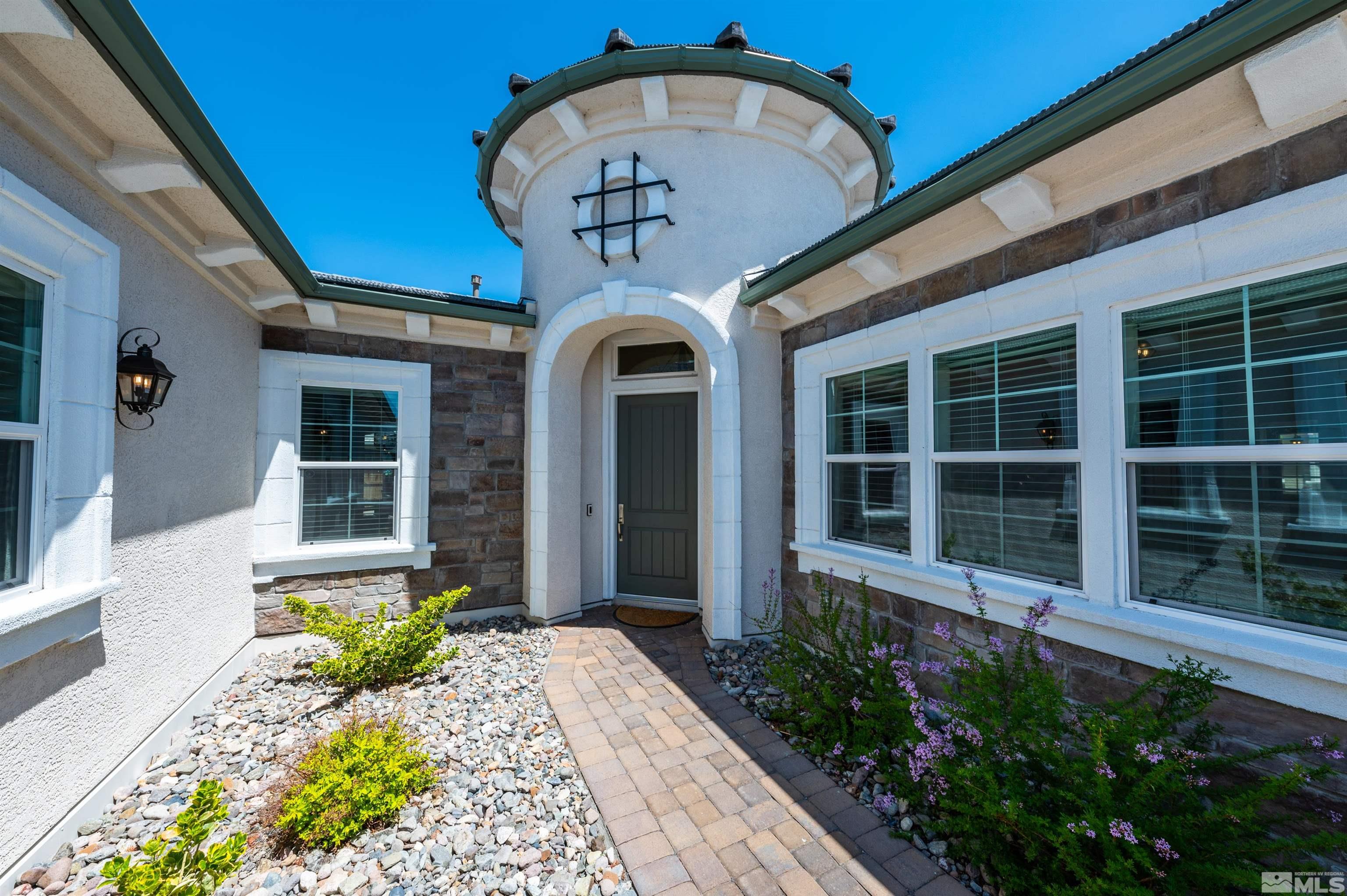 9604 Copperhorn Way Reno, NV 89521 - Photo 2 of 39 a front view of a house with a porch