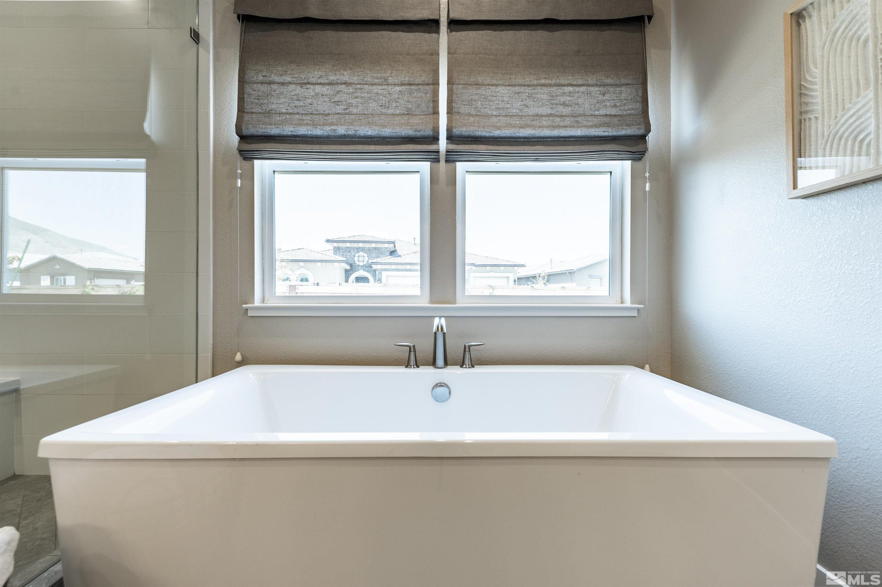 9604 Copperhorn Way Reno, NV 89521 - Photo 21 of 39 a bathroom with a sink