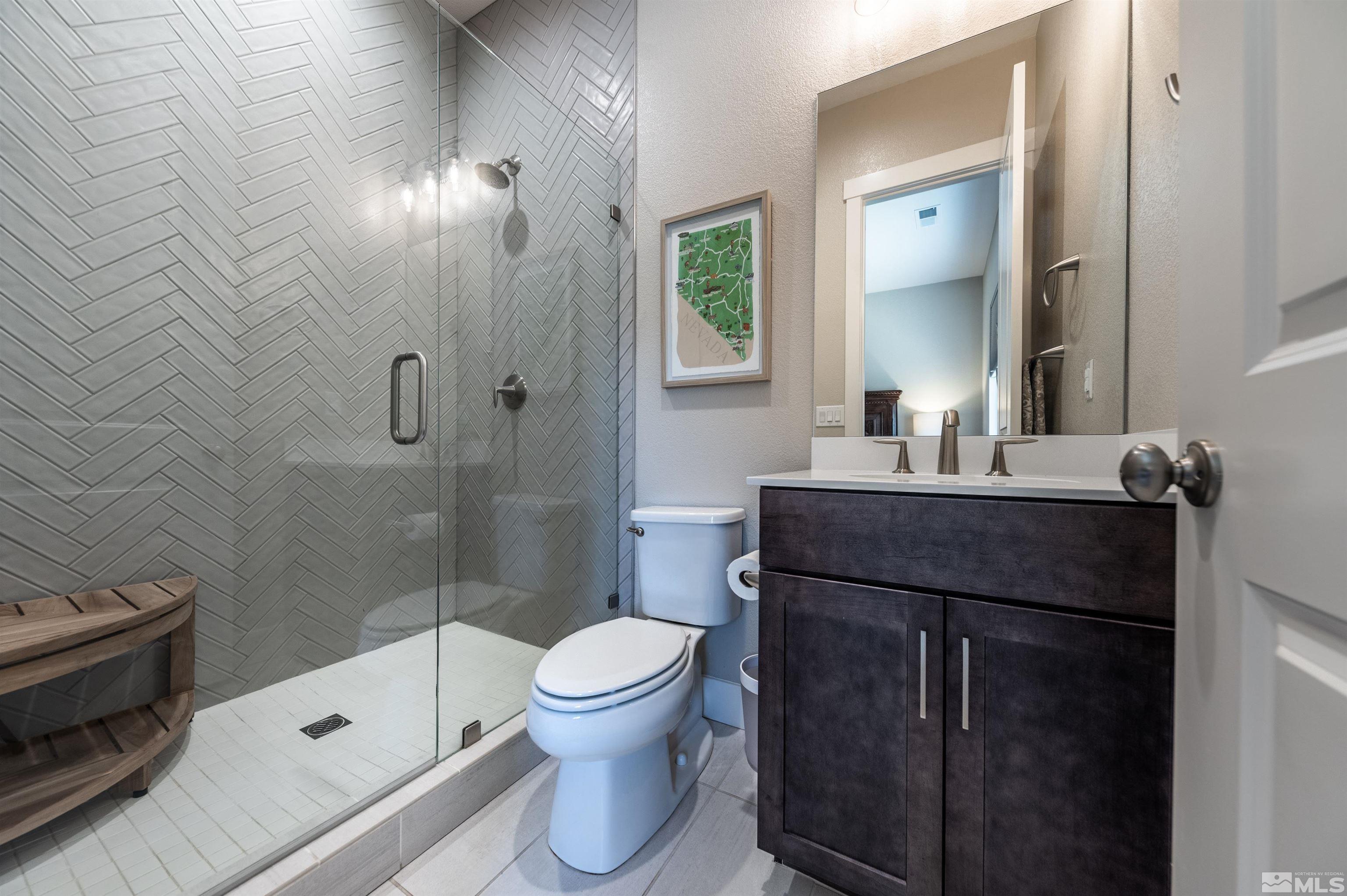 9604 Copperhorn Way Reno, NV 89521 - Photo 28 of 39 a bathroom with a sink a toilet and shower