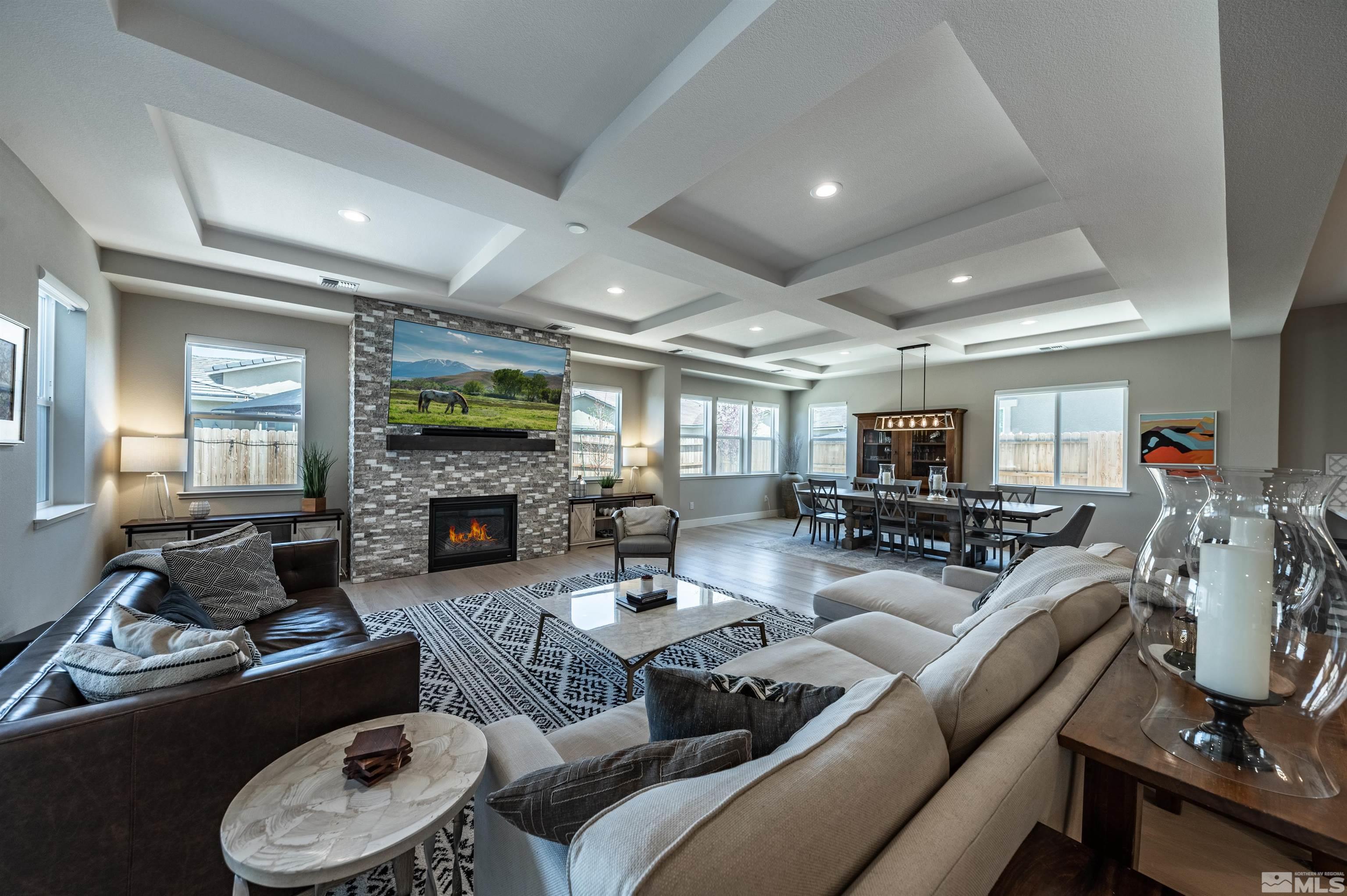 9604 Copperhorn Way Reno, NV 89521 - Photo 3 of 39 a living room with furniture fireplace and a flat screen tv