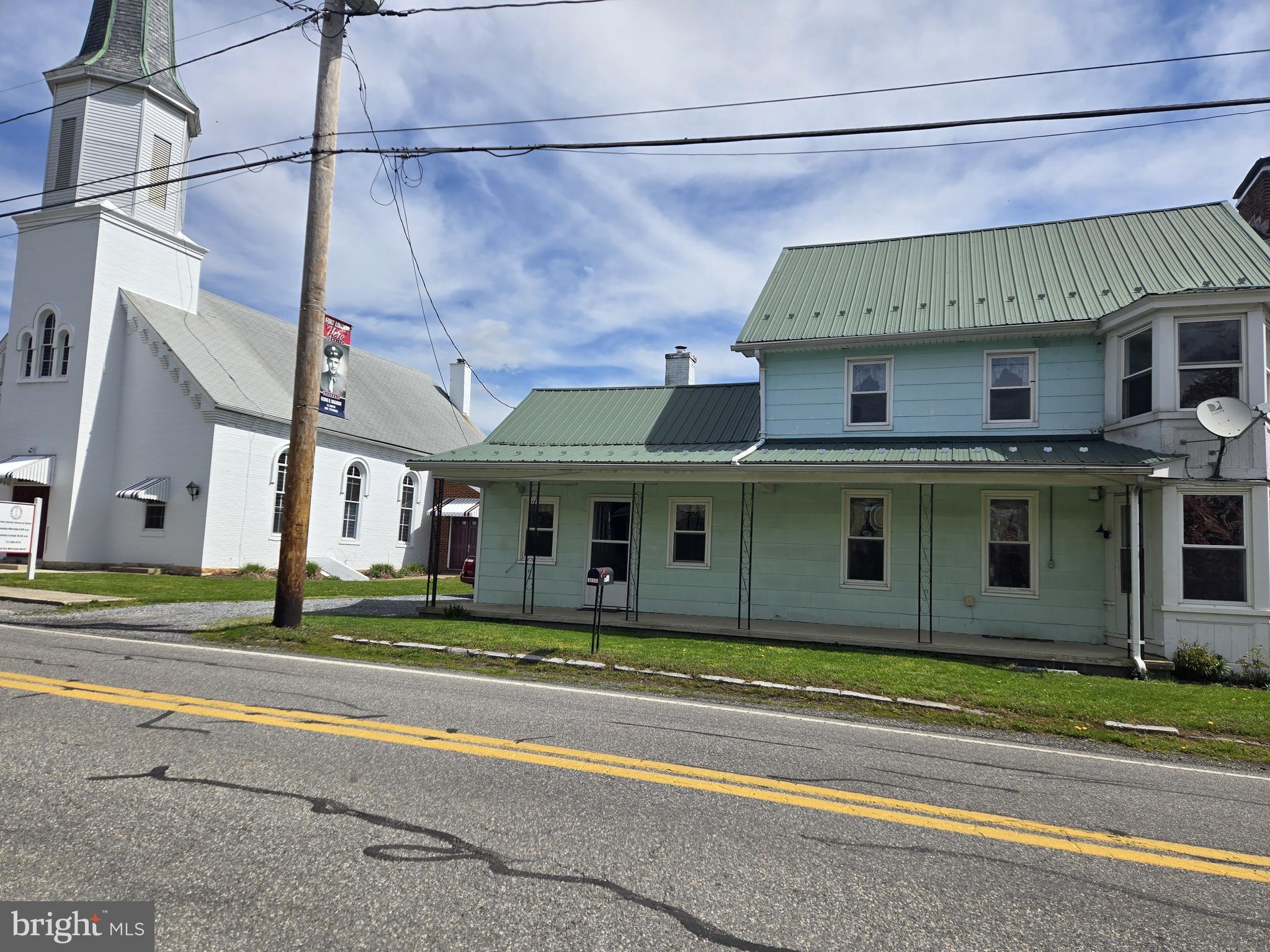 13177 Main Street Fort Loudon, PA 17224 - Photo 2 of 24 a view of a white house with a large windows and a yard
