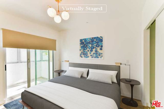 a large white kitchen with stainless steel appliances