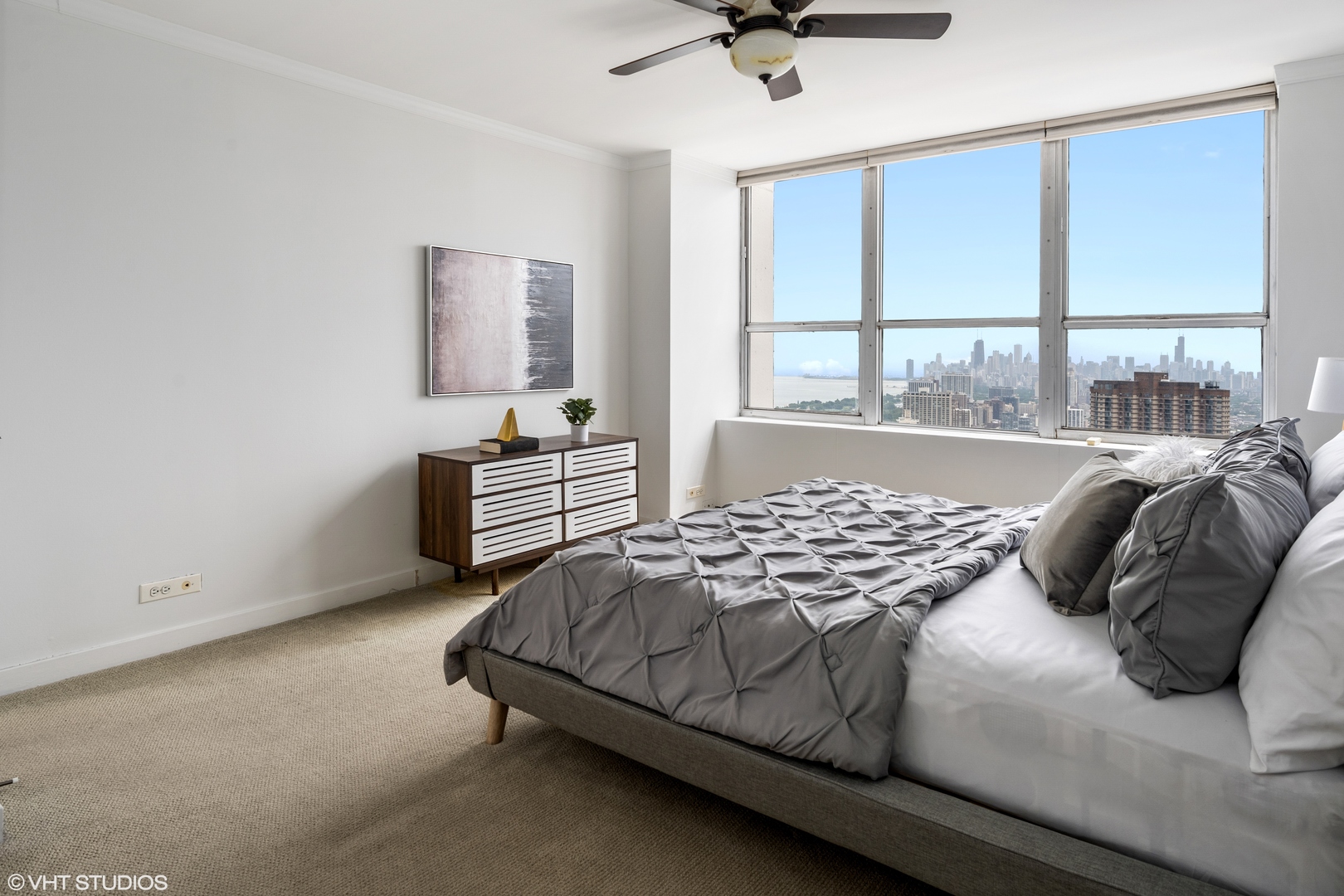 655 West Irving Park Road, Unit 5301 Chicago, IL 60613 - Photo 11 of 20 a bedroom with a bed and window