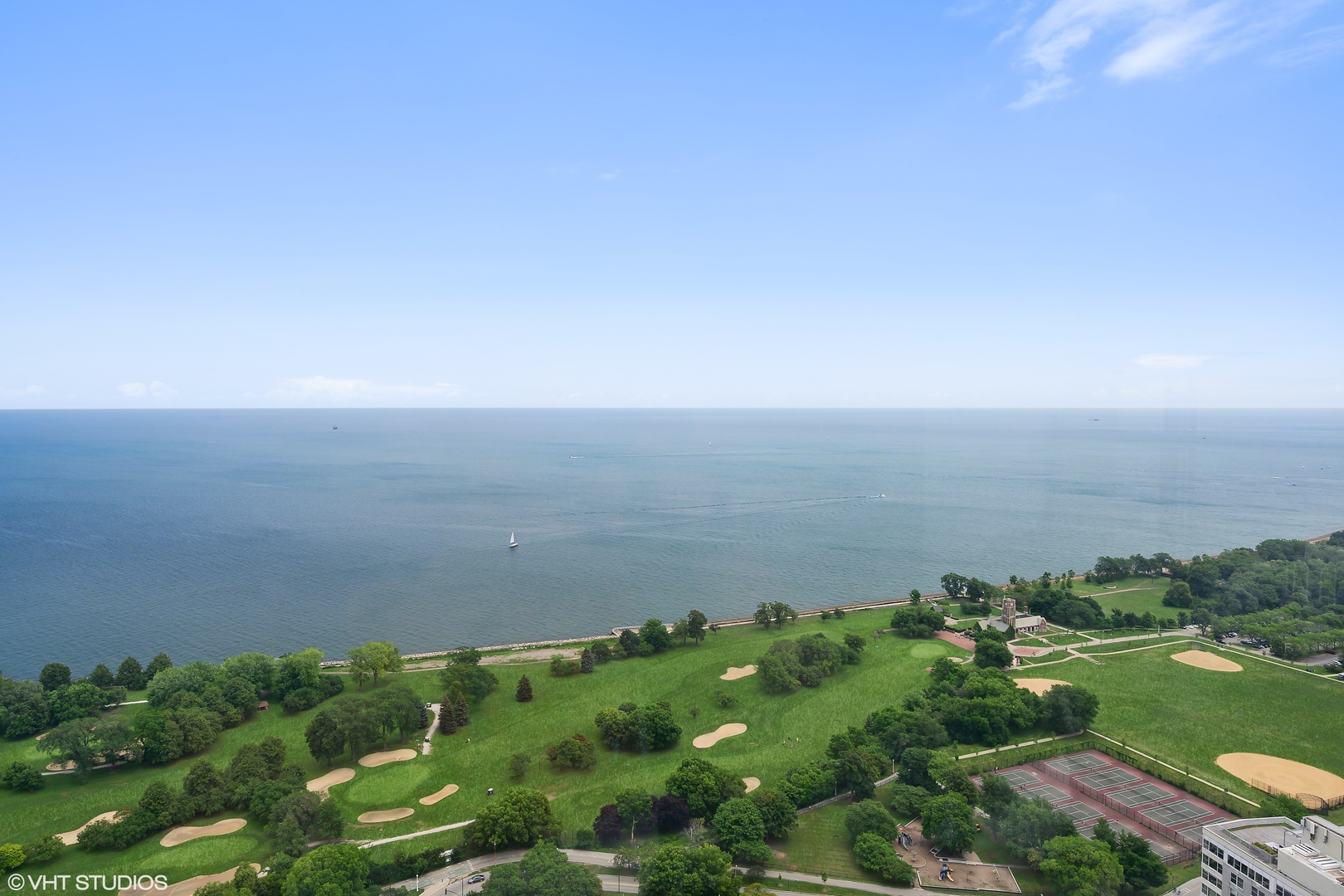 655 West Irving Park Road, Unit 5301 Chicago, IL 60613 - Photo 17 of 20 a view of a lake with houses in back