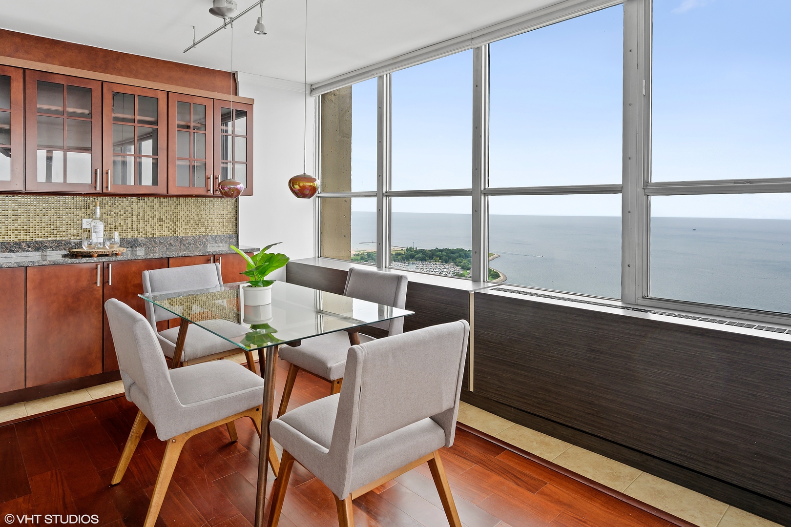 655 West Irving Park Road, Unit 5301 Chicago, IL 60613 - Photo 5 of 20 a dining room with furniture and window