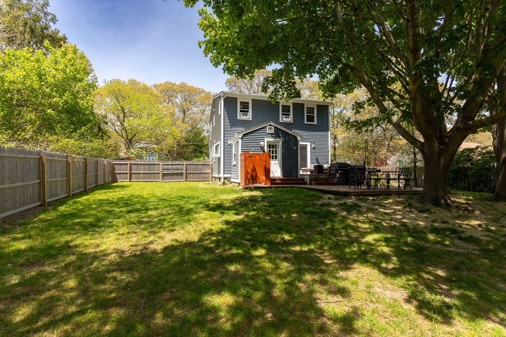 1020 Old Falmouth Road Barnstable, MA 02632 - Photo 8 of 42 a front view of a house with a yard