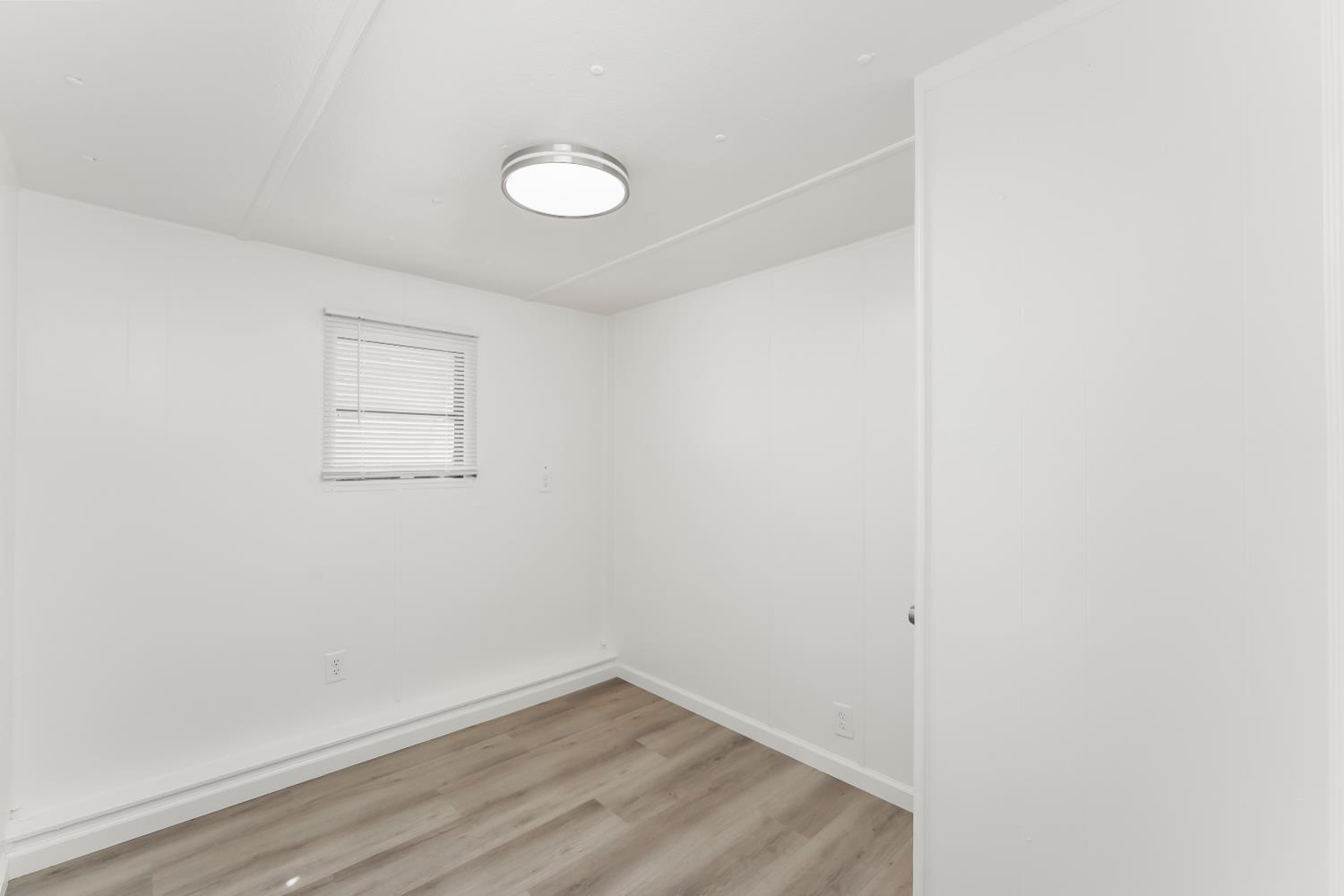1525 Cold Springs Road, Unit 48 Placerville, CA 95667 - Photo 16 of 44 a view of a small space with wooden floor and a window