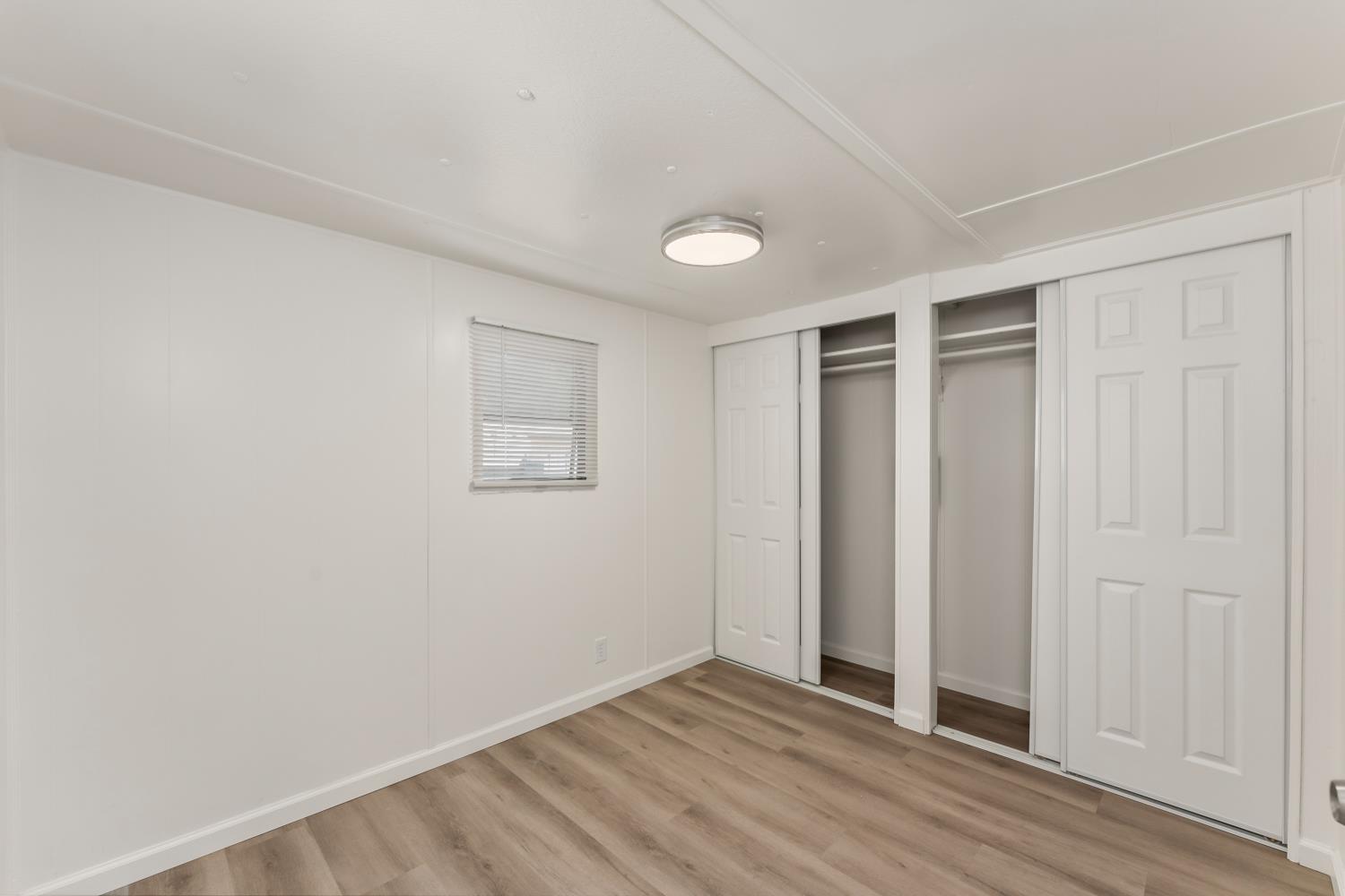 1525 Cold Springs Road, Unit 48 Placerville, CA 95667 - Photo 21 of 44 an empty room with wooden floor