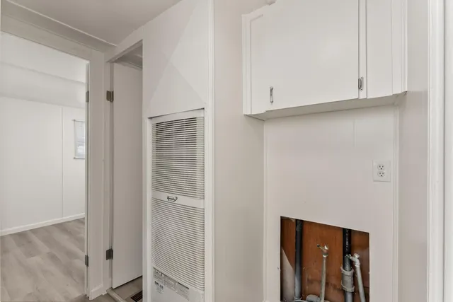 a view of cabinets and window