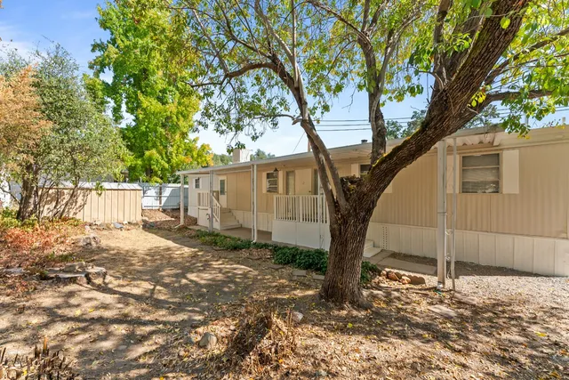 a view of a house with a fence