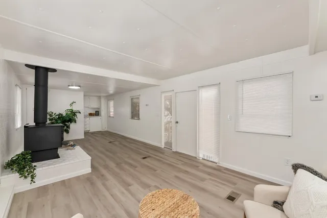 a view of a livingroom with furniture and wooden floor