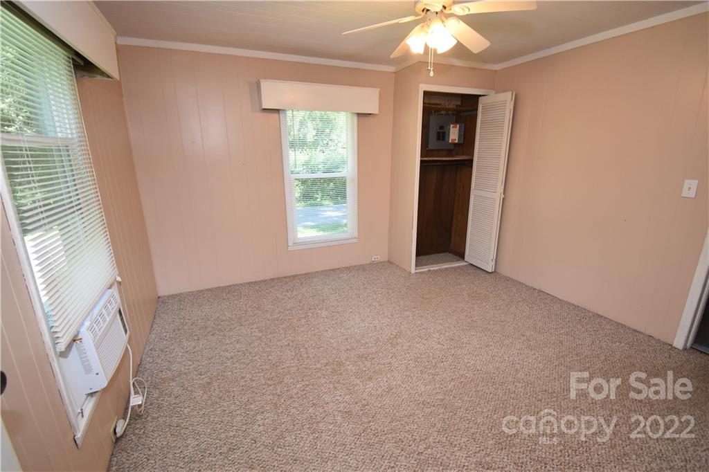 210 Proctor Street Lincolnton, NC 28092 - Photo 11 of 19 a view of an empty room with window and cabinet