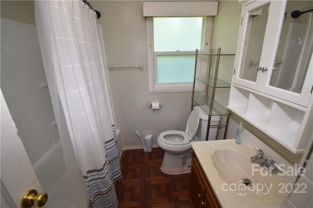 210 Proctor Street Lincolnton, NC 28092 - Photo 15 of 19 a bathroom with a sink and a toilet