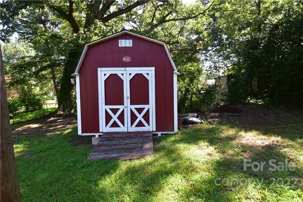 210 Proctor Street Lincolnton, NC 28092 - Photo 16 of 19 a front view of a house with garden