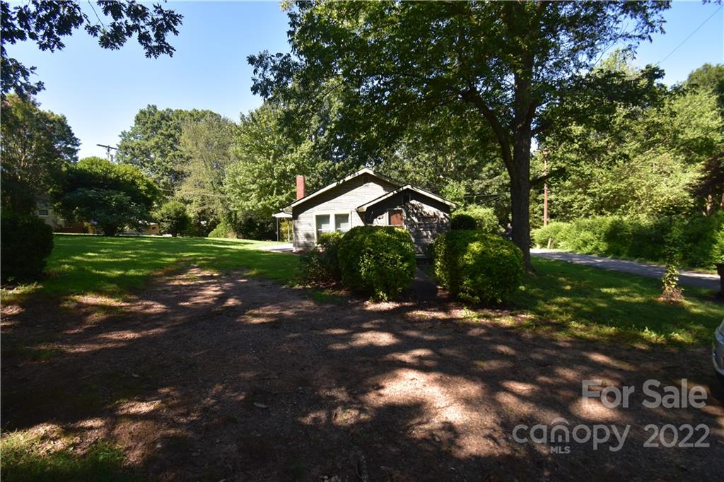210 Proctor Street Lincolnton, NC 28092 - Photo 19 of 19 a backyard of a house with lots of green space