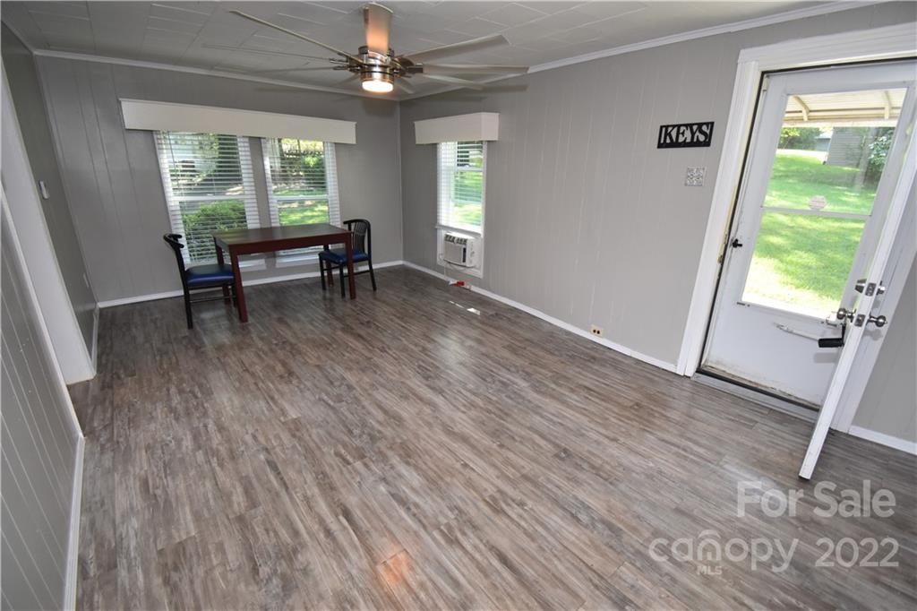 210 Proctor Street Lincolnton, NC 28092 - Photo 4 of 19 a view of a livingroom with furniture window and wooden floor