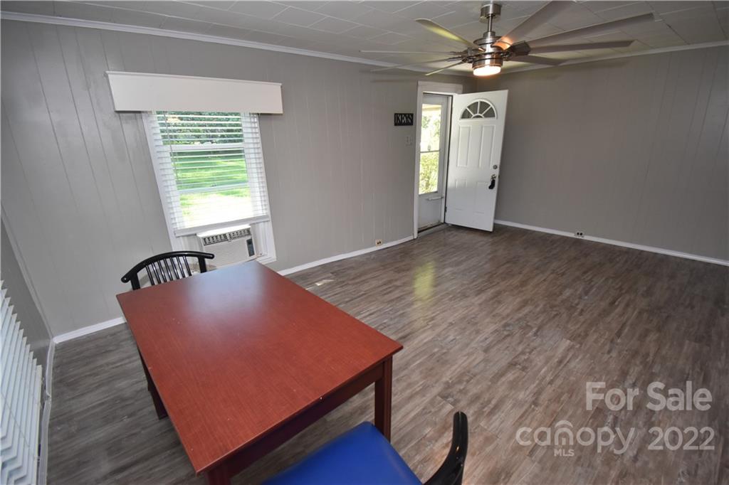 210 Proctor Street Lincolnton, NC 28092 - Photo 5 of 19 wooden floor with windows and chandelier
